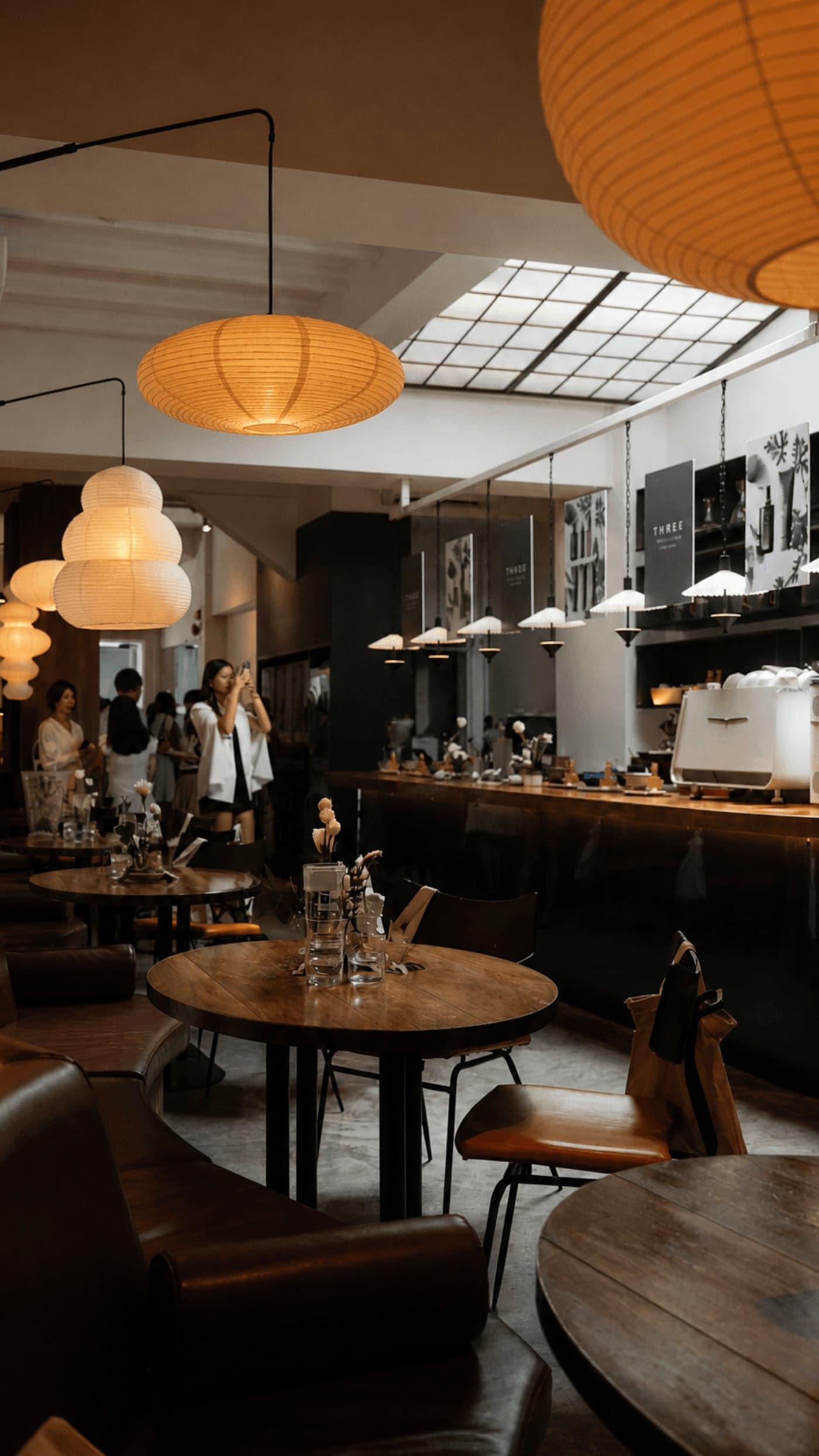 Cafe Gyoen interior with espresso bar and hanging lamps
