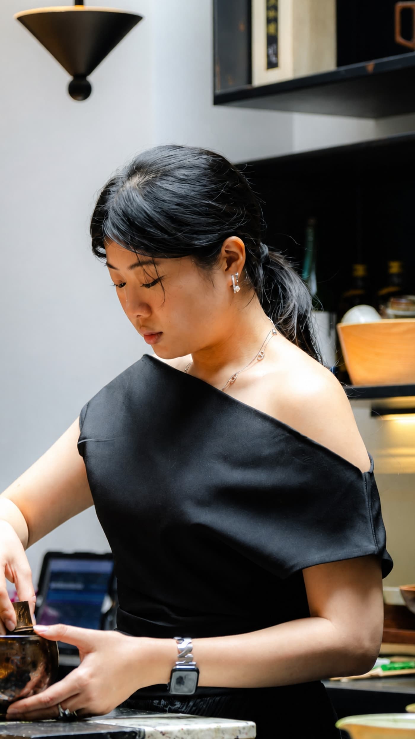 Tea practitioner preparing matcha at Cafe Gyoen
